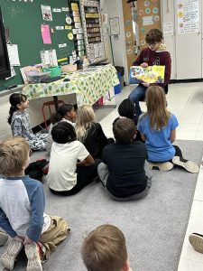 Middle Township Middle School student reading to MTE#2 students to kick off Read Across America Week.
