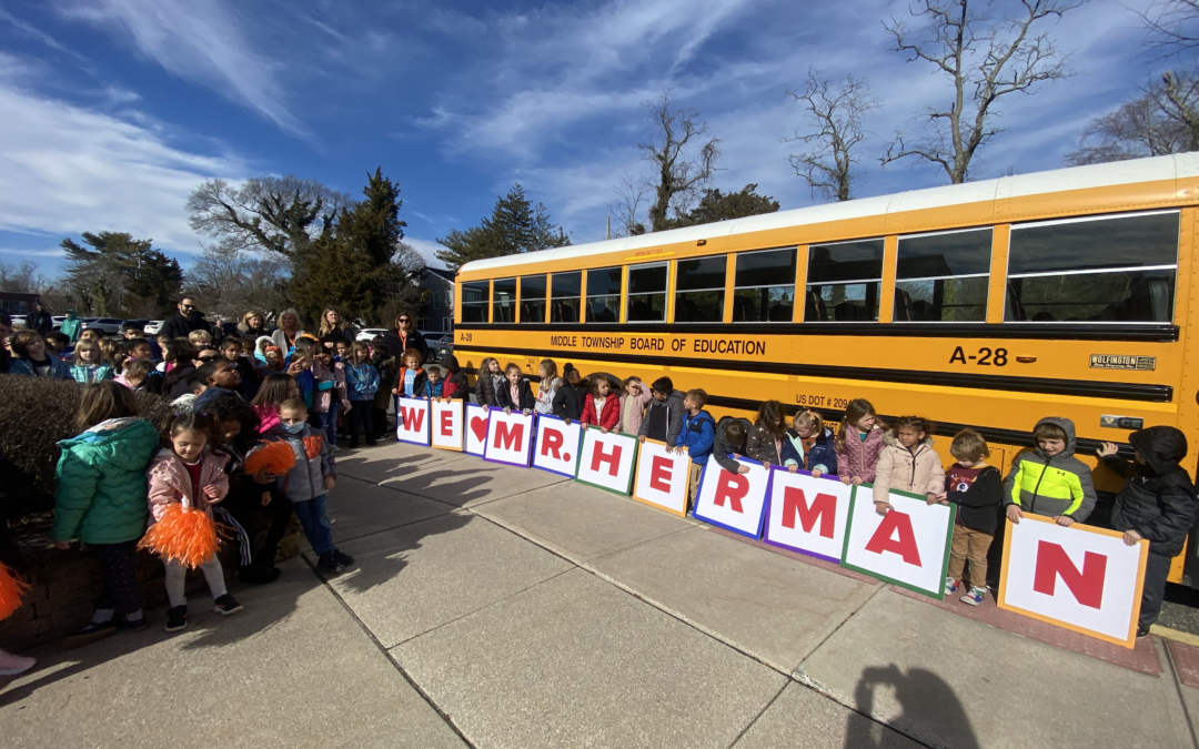 Elementary 1 Students lined up outside to surprise school bus driver