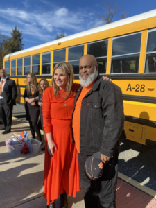 Herman Cruse and Jenna Bush Hagar posing for a photo in front of A28 bus during Today Show filming