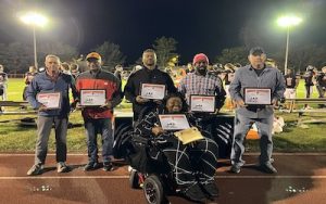 Middle Township School District Hall of Fame Inductees pose for a group photo during a football game Oct. 13. In the front is Gloria Hodges and left to right are Bob Metz, Markal Ginyard's father Steven Ginyard, Damon Troy, Dr. PD Moore and Steven Seymour.