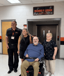 (L-R) MTPS Superintendent Dr. David Salvo, Jennifer Tyndall (daughter), Richard Ludwig and Antoinette Ludwig (wife) stand with the new signage for the Richard P. Ludwig Band Room.