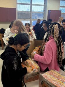 Key club students packing meals