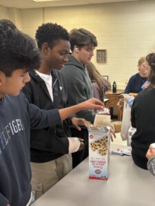 Key club students packing meals