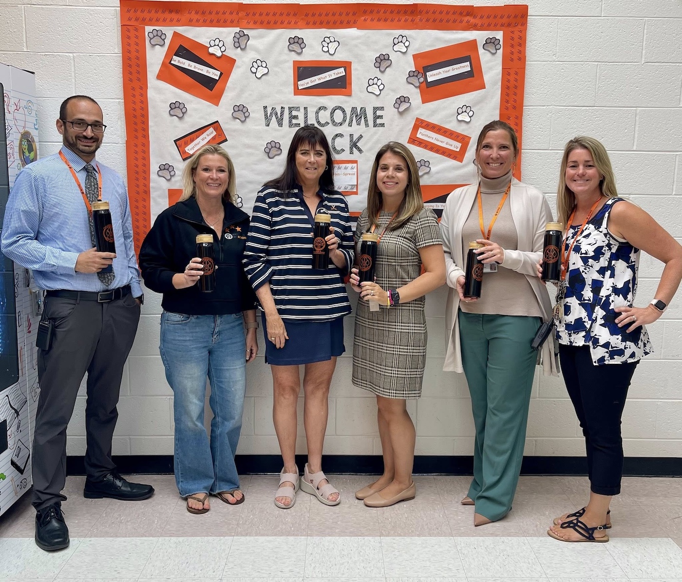 Middle Township Elementary School #2 Assistant Principal Vince Tridente (from) left), Panthers in Action board member Alicia Woodrow, Burke Subaru Director of Communications Francey Kanengiser Burke, Panthers in Action board member Jennifer Heun, Middle Township Elementary School #2 Principal Carrie Sinone and Panthers in Action board member Kelly Cox team up to deliver water bottles to students.
